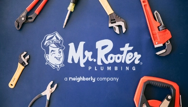 Blue background with tools surrounding white Mr. Rooter logo.