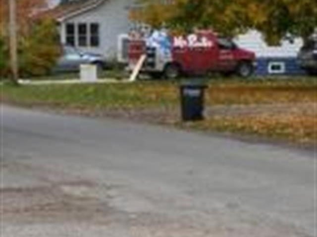 A Mr rooter van on a work site