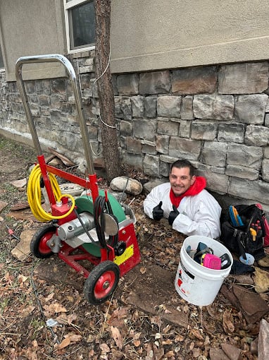 David Repairing a clogged drain