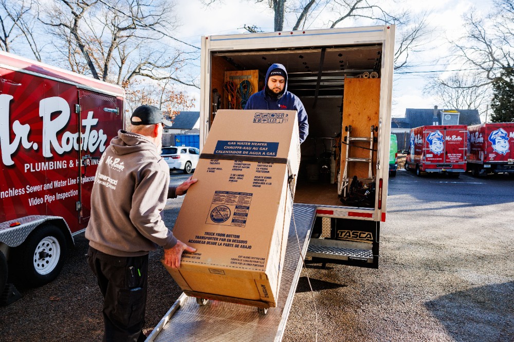 Loading a new water heater on the truck