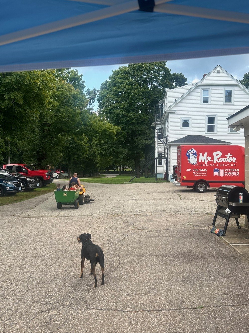 Taking the kids for a tractor ride at our employee appreciation party
