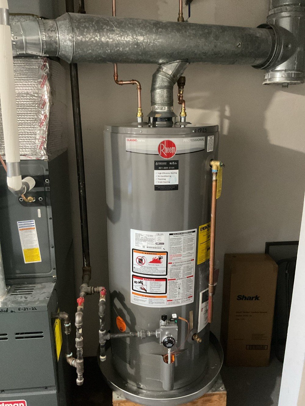 Water heater with flood stop pan