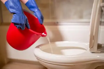 image of hot water being poured into toilet bowl