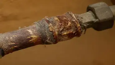 Old pipe corroding and rusting.