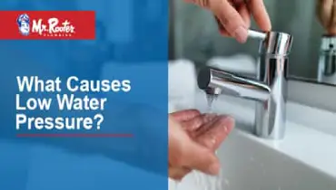 Person washing hands with text: What causes low water pressure