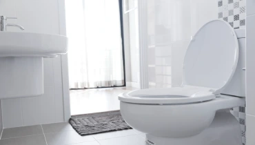 Clean White Toilet and Bathroom