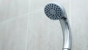 Shower head with low water stream due to water pressure issues.