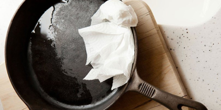 grease in a castiron pan with a paper towel
