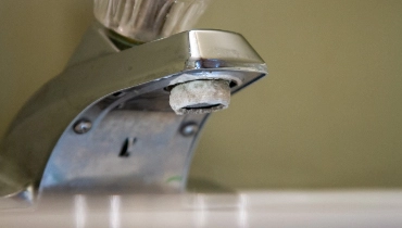 A faucet with calcium buildup