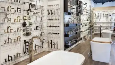 Plumbing fixture showroom with faucets and tubs