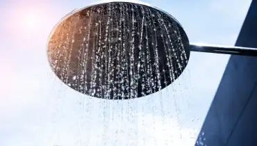 Outdoor shower head spraying water