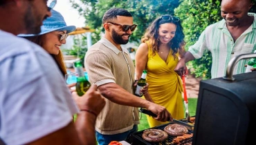 Diverse group of friends and family grilling | Mr. Rooter Plumbing of South Jersey.