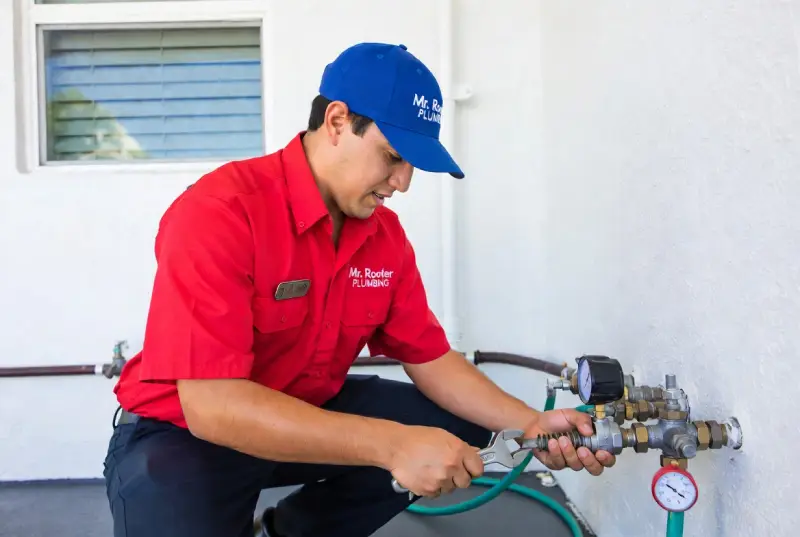 Mr. Rooter professional preventing a plumbing emergency.