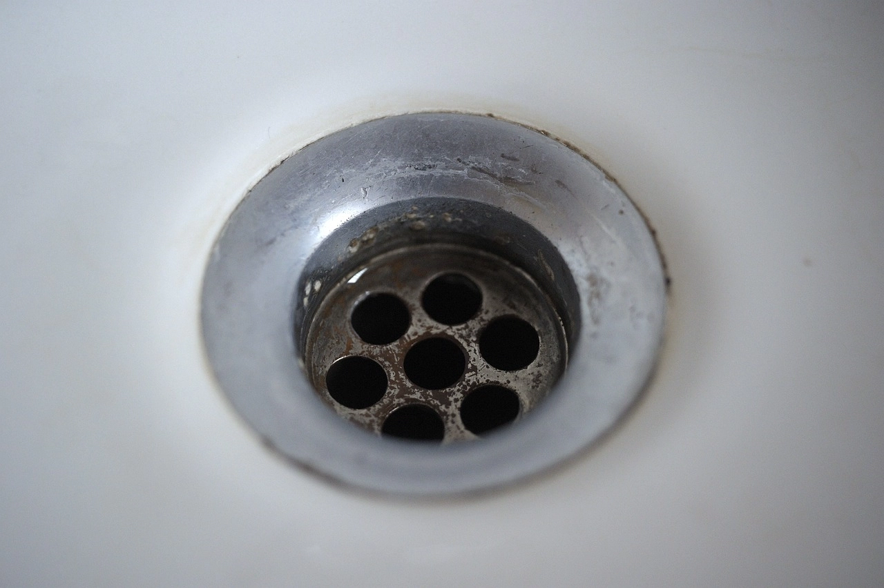 A sink drain after it has been cleared with the help of professional services for clogged drains in Columbia SC.