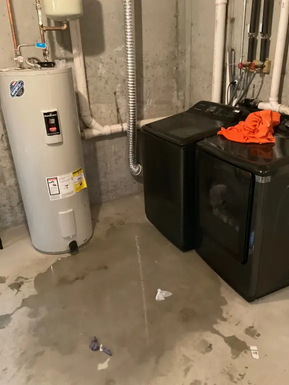 Leaking water heater in Ronkonkoma home indicating a replacement water heater is needed