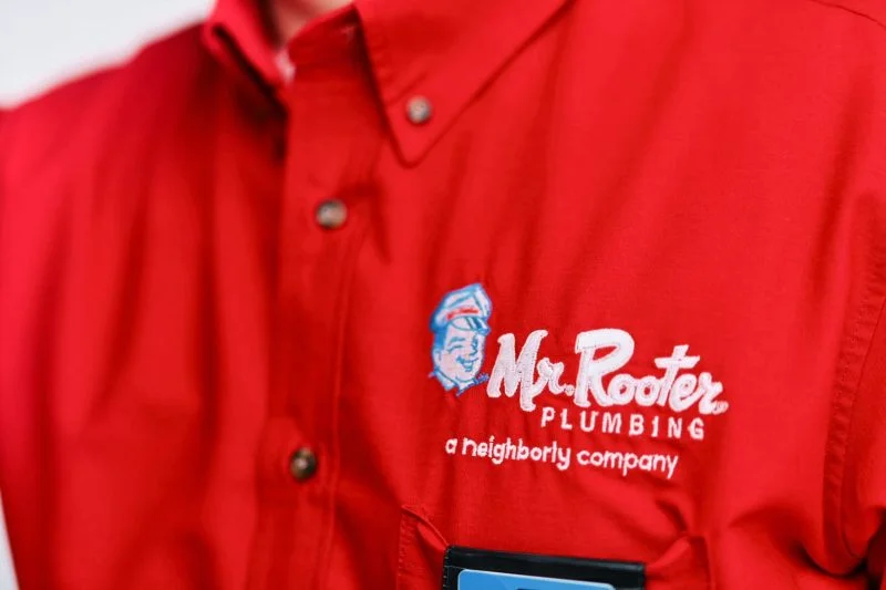 Mr. Rooter Plumbing logo on a Cleveland, OH sewer repair specialist’s shirt. 