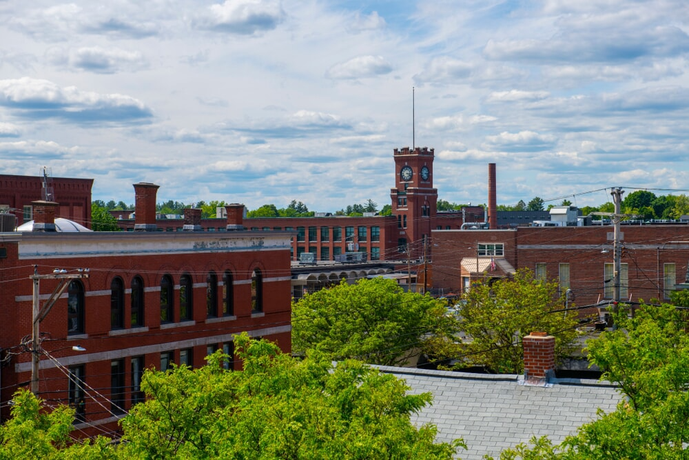 Red brick buildings and greenery in Nashua, New Hampshire.